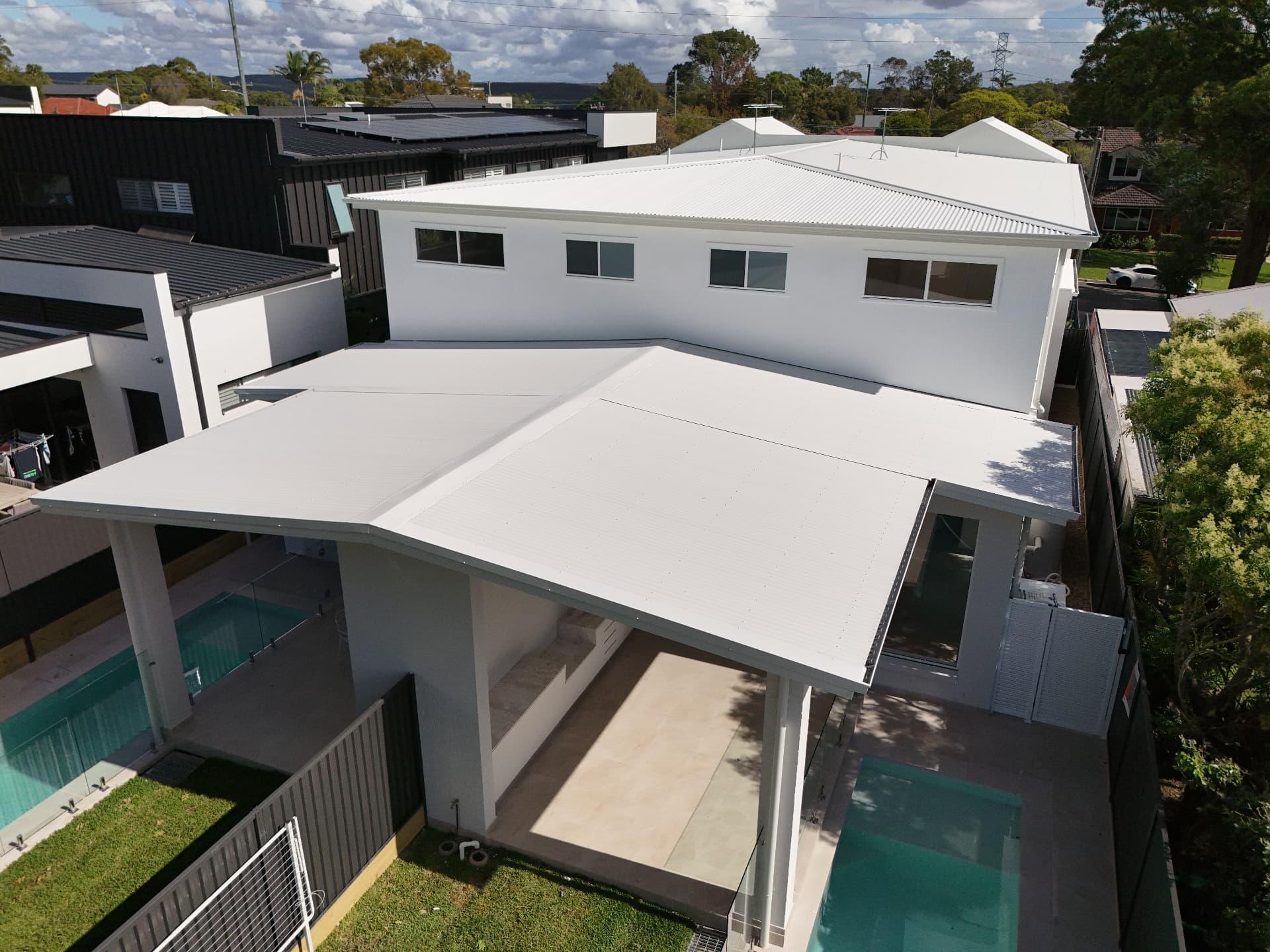 White COLORBOND steel roof on a modern two-storey Sydney home, installed by Marvel Roofing Projects
